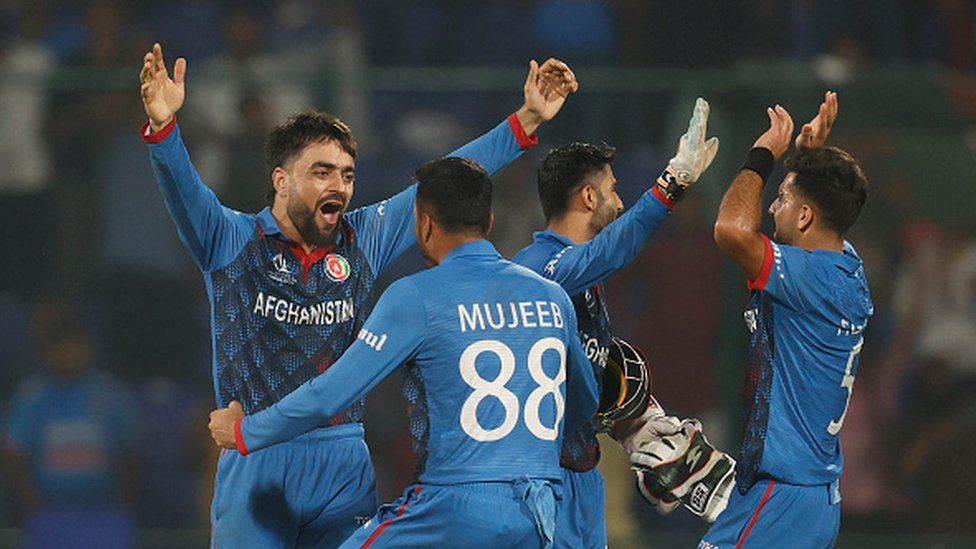 : Rashid Khan of Afghanistan celebrates the wicket of Mark Wood of England to win by 69 runs during the ICC Men's Cricket World Cup India 2023 between England and Afghanistan at Arun Jaitley Stadium on October 15, 2023 in Delhi, India.