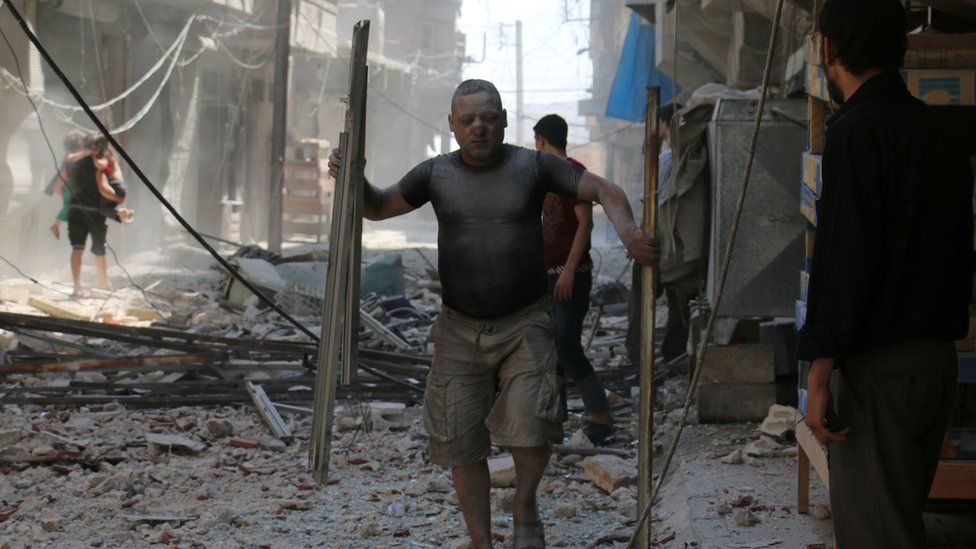 Aftermath of reported air strike on rebel-held district of Sakhur in the northern Syrian city of Aleppo on 15 August 2016