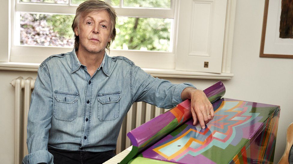 Sir Paul McCartney at home with his original Magic Piano