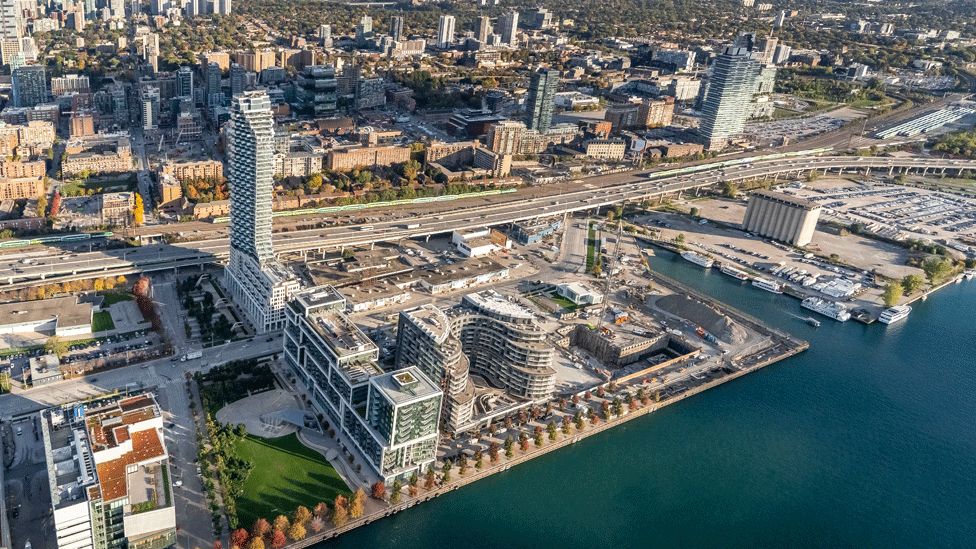 Aerial shot of Toronto with the waterfront land in front