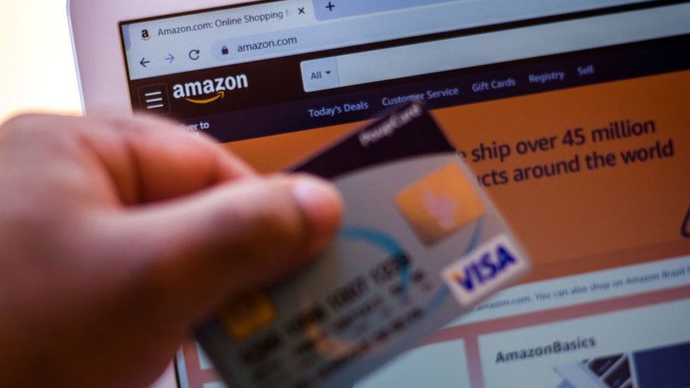 Visa card and Amazon website