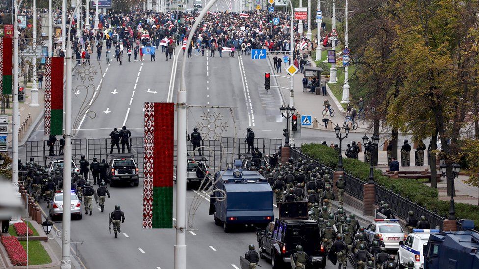 Belarusian police block a road against protesters during a rally against President Lukashenko in Minsk, Belarus, 25 October 2020