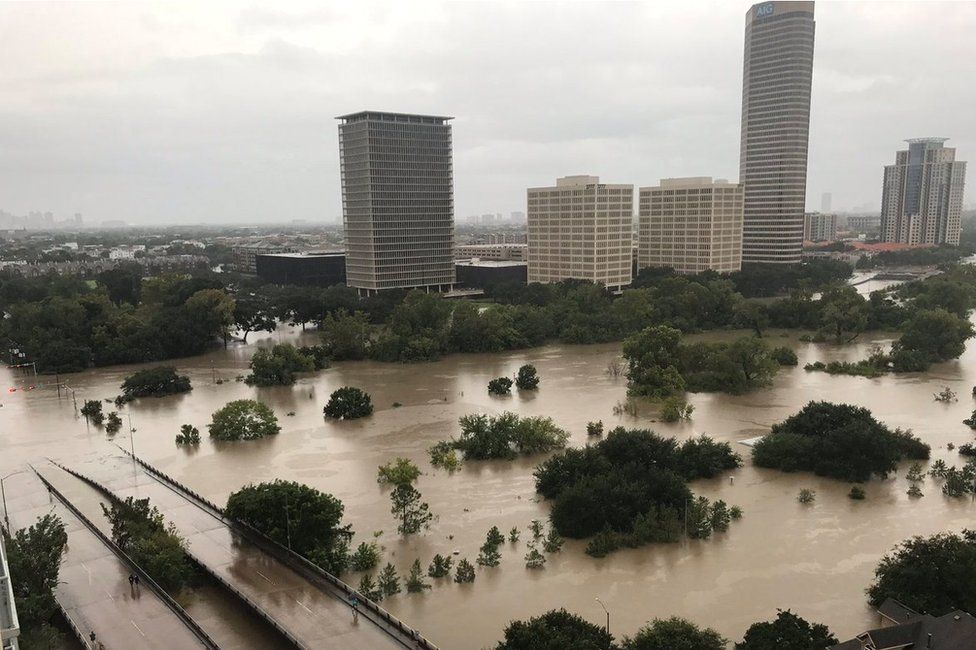 Flooded downtown Houston is seen from a high rise building along Buffalo Bayou