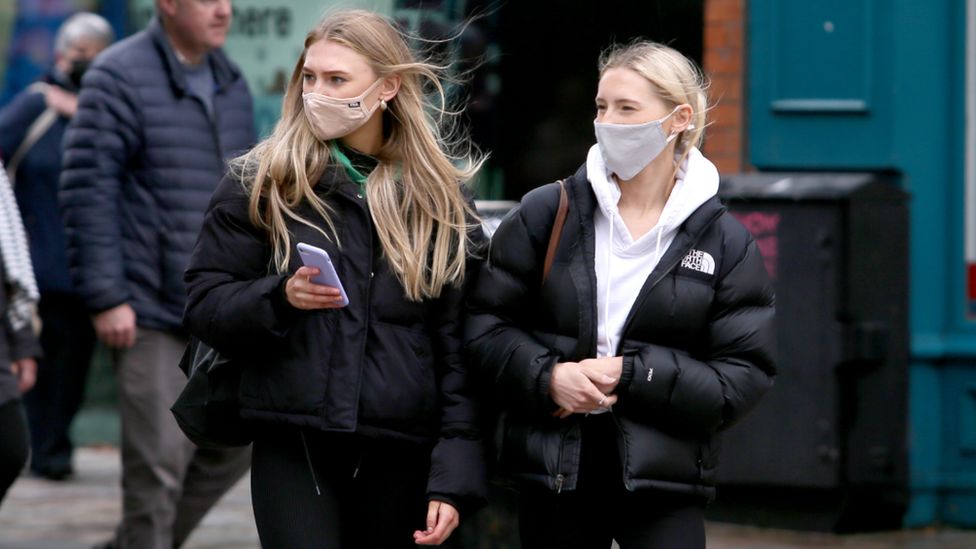 Two young women in Belfast as further lockdown restrictions are imposed