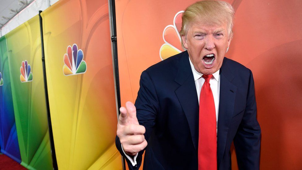 In this Jan. 16, 2015 file photo, Donald Trump, host of the reality television series "The Celebrity Apprentice," poses for photographers at the NBC 2015 Winter TCA Press Tour in Pasadena, Calif.