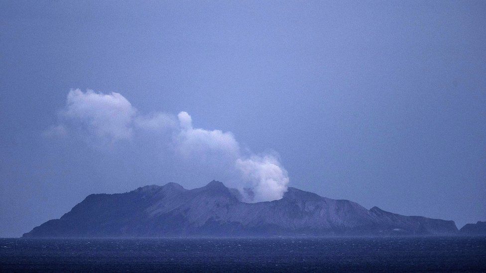Smoke and ash rises from a volcano on White Island early in the morning on December 9, 2019 in Whakatane, New Zealand