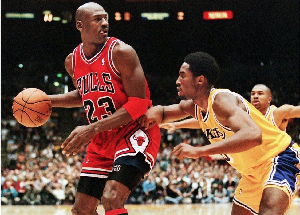 Michael Jordan being guarded by Kobe Bryant of the Los Angeles Lakers