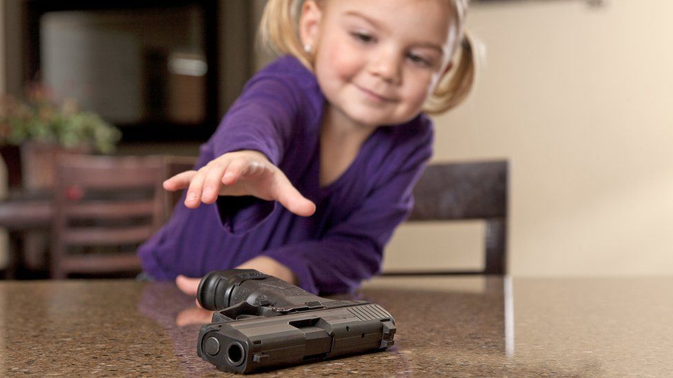Little girl with gun