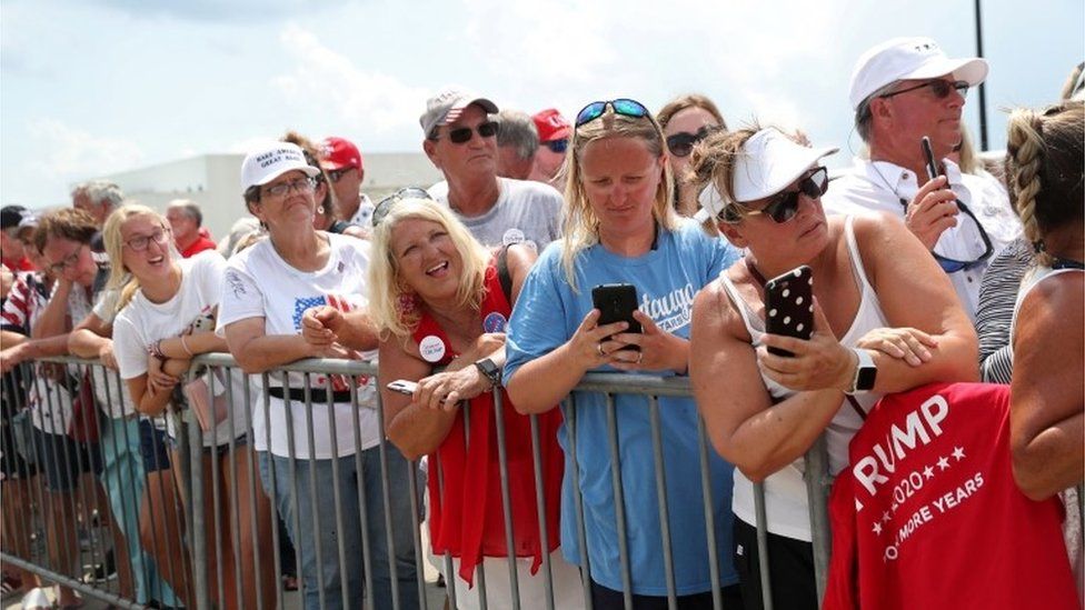 Trump supporters wait for the president in North Carolina, 2 August 2020