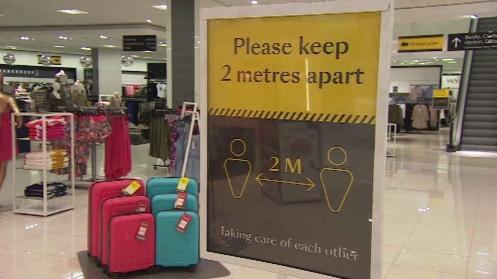A sign reading 'please keep 2 metres apart'