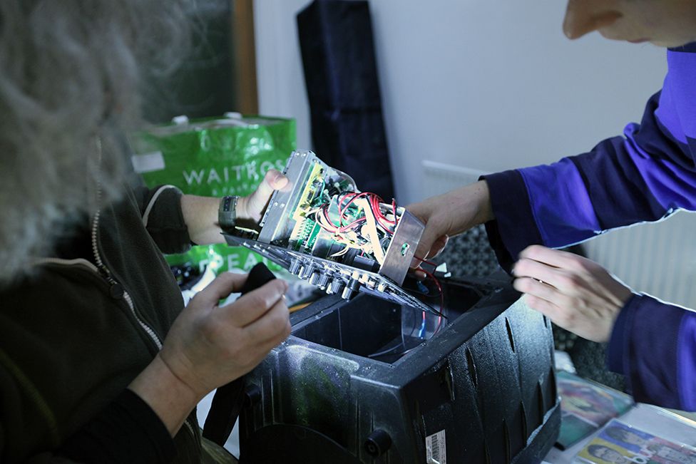 Stephania and Harry repair a portable speaker at the Fixing Factory in Camden, London