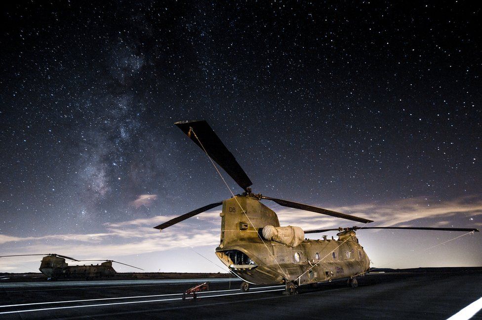 Two Chinooks sit on the flight line at Twenty Nine Palms US Marine Corps base in California US.