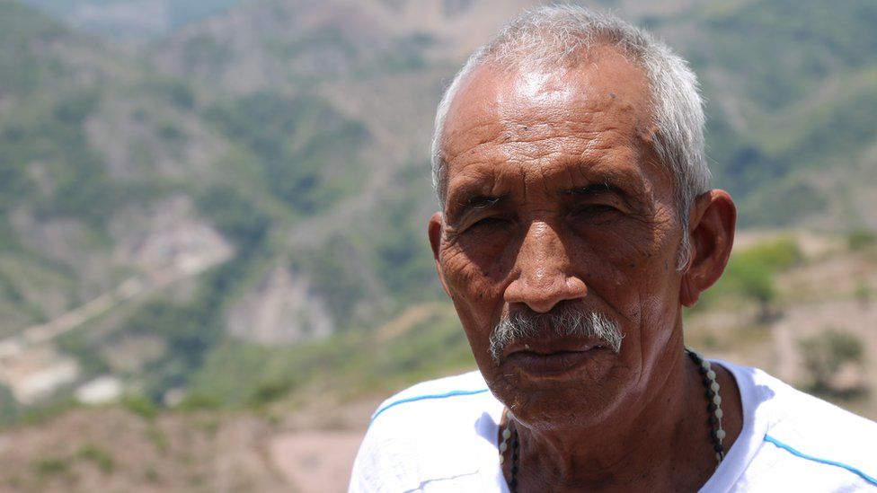 Farmer Marco Tulio stands on drought-affected land