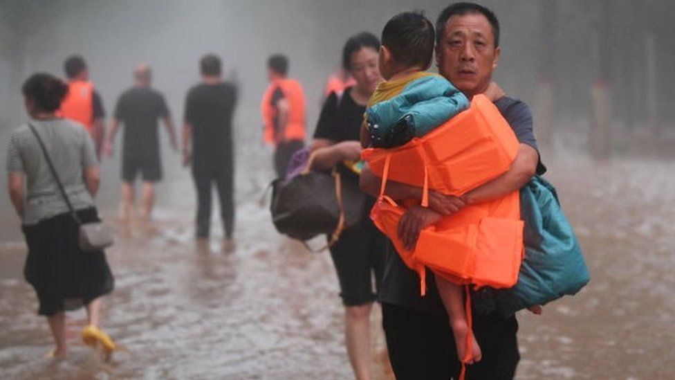 Trapped people are evacuated at flood-hit Tazhao village on August 1, 2023 in Zhuozhou, Hebei Province of China.