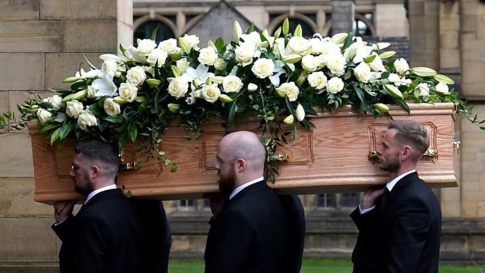 The coffin of Sir Bobby Charlton is carried by pallbearers into Manchester Cathedral ahead of the funeral service