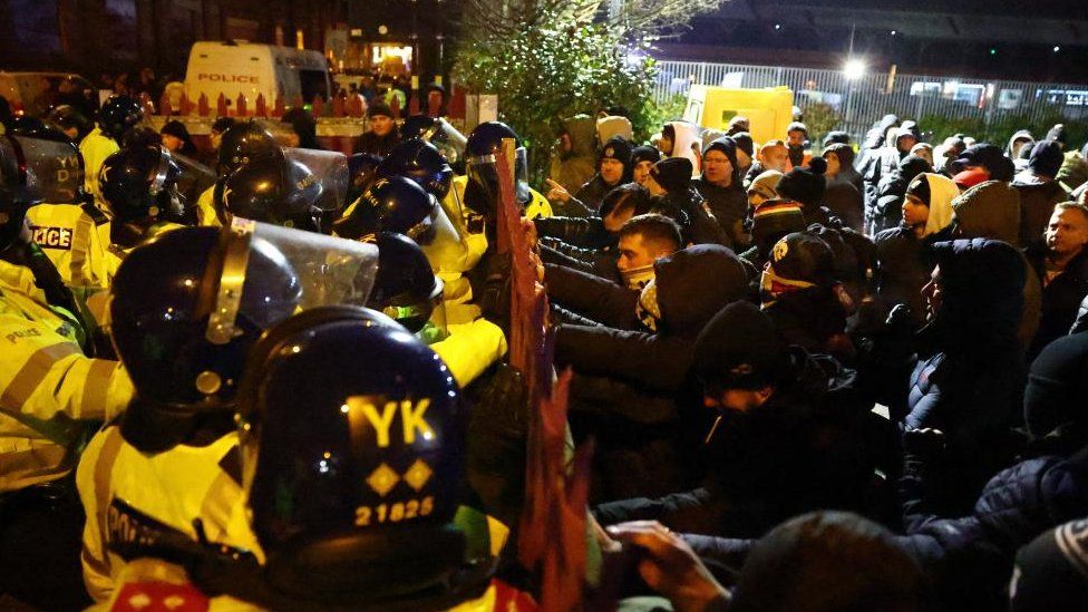 Police clashing with football fans