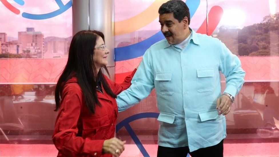 Photo released by the Venezuelan Presidency of Venezuelan President Nicolas Maduro (R) and First Lady Cilia Flores dancing during a radio program in Caracas on November 1, 2016.