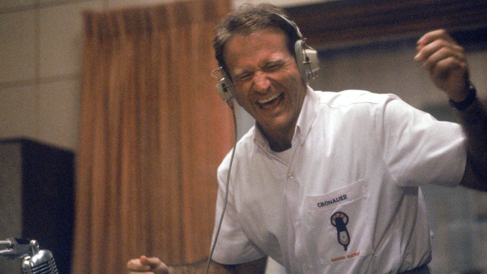 Robin Williams in DJ booth in role of Adrian