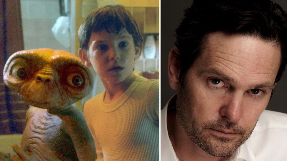Henry Thomas now and as Elliott with ET in a photo from the film