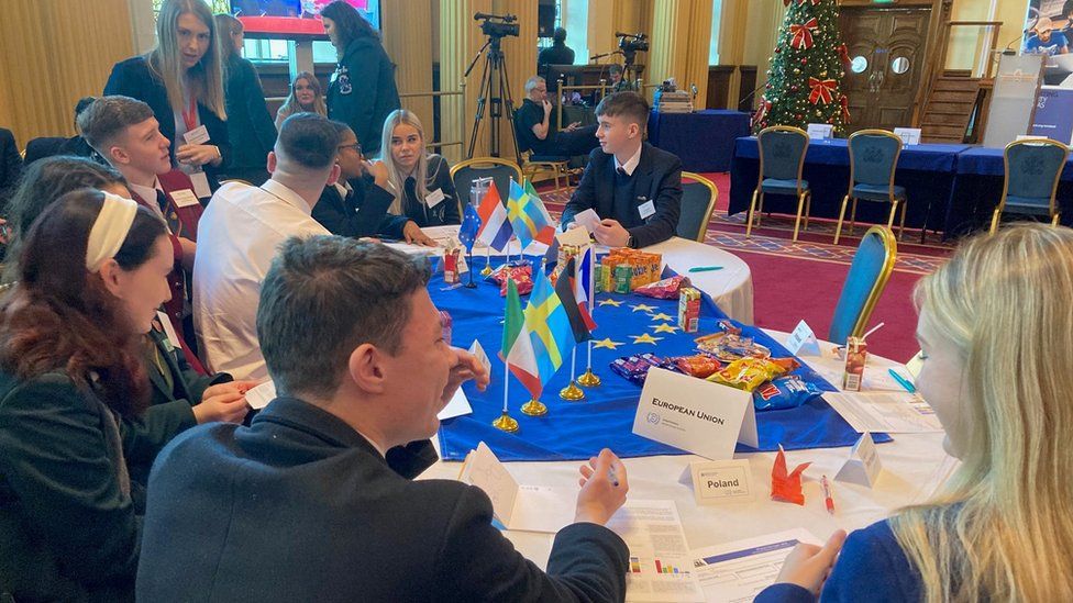 Pupils talking at the mock COP28 event in Belfast City Hall