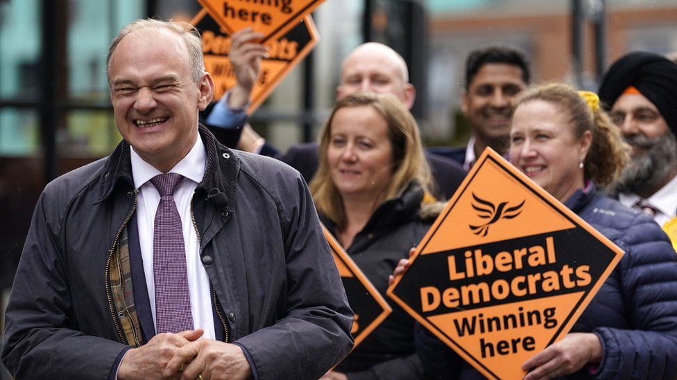 Leader of the Liberal Democrats Sir Ed Davey during a visit to Windsor, with supporters, after Lib Dems take control of council