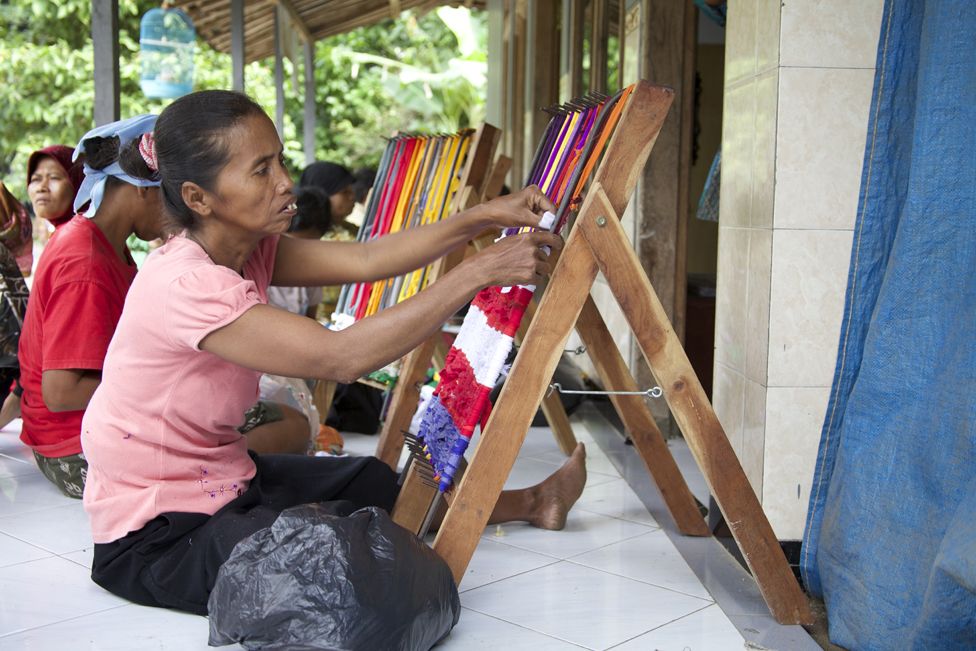 Disabled villagers weave doormats to make a living