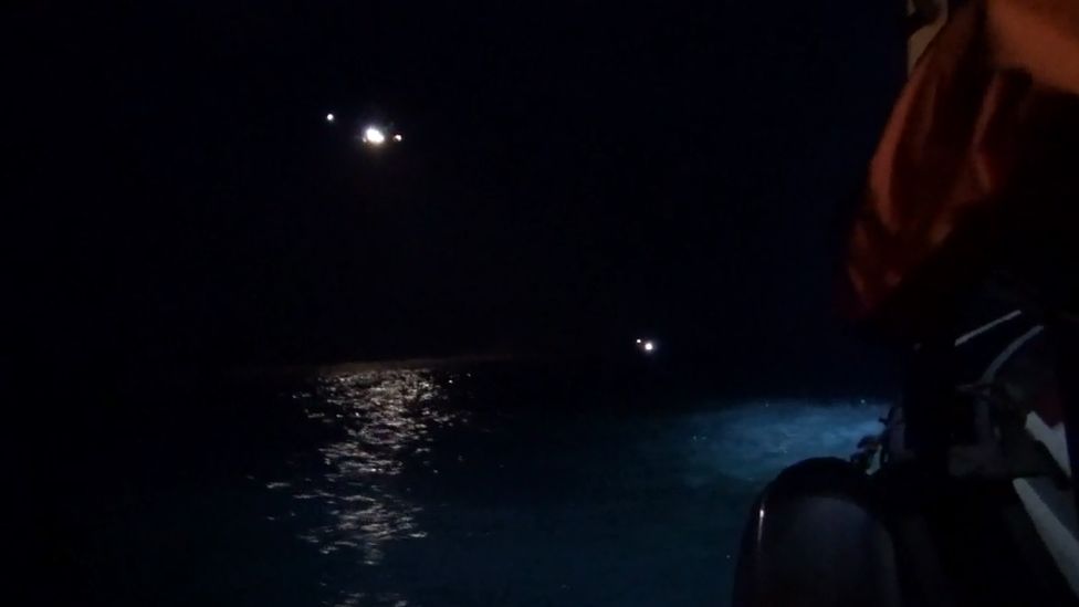 Helicopter searching for missing swimmer