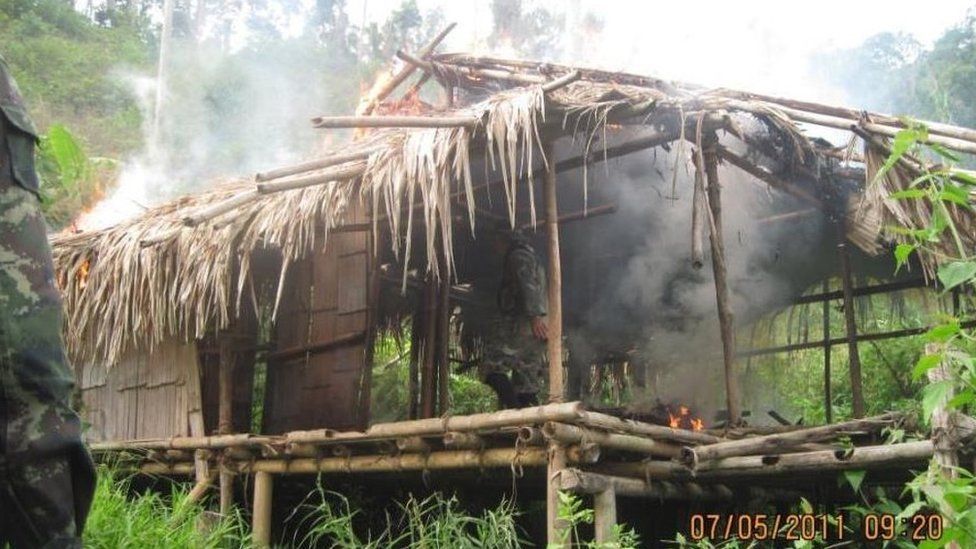 A hut begins to burn