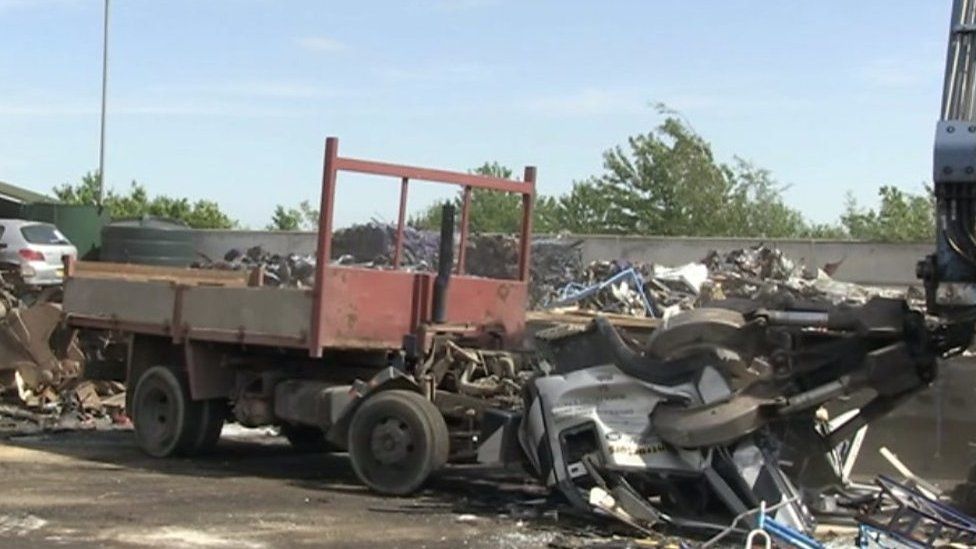 Crushed fly-tip lorry