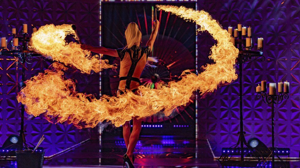 Gothy Kendoll performing with fire during the Drag Race UK vs The World talent competition.