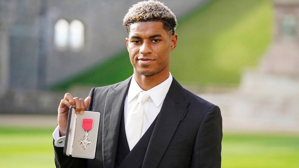Marcus Rashford stands in Windsor Castle grounds
