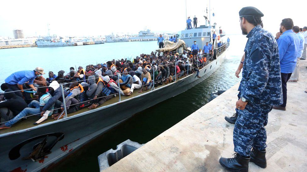 Migrants rescued by the Libyan coastguard in the Mediterranean off the Libyan coast arrive at a naval base in the capital, Tripoli, on 26 May 2017