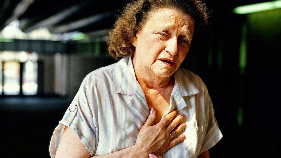 Woman having a heart attack