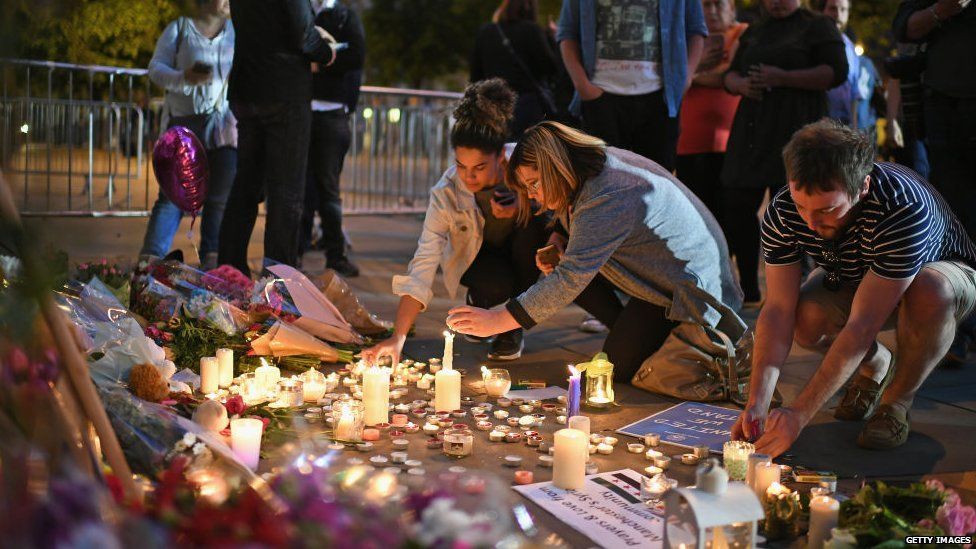 People gathered to light candles