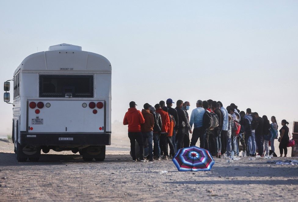 A US border patrol bus takes migrants to a processing centre