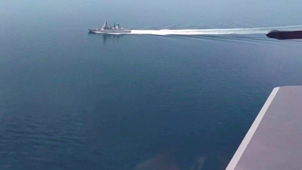 A still image taken from a video released by Russia's Defence Ministry allegedly shows British Royal Navy's Type 45 destroyer HMS Defender filmed from a Russian military aircraft in the Black Sea, June 23, 2021