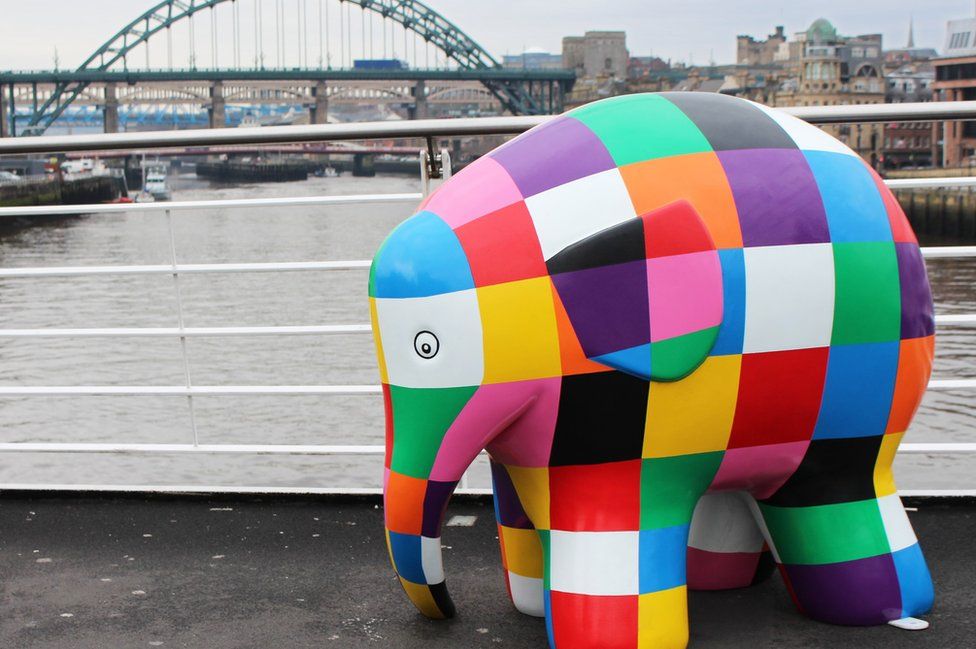 An Elmer sculpture with the Tyne Bridge in the background