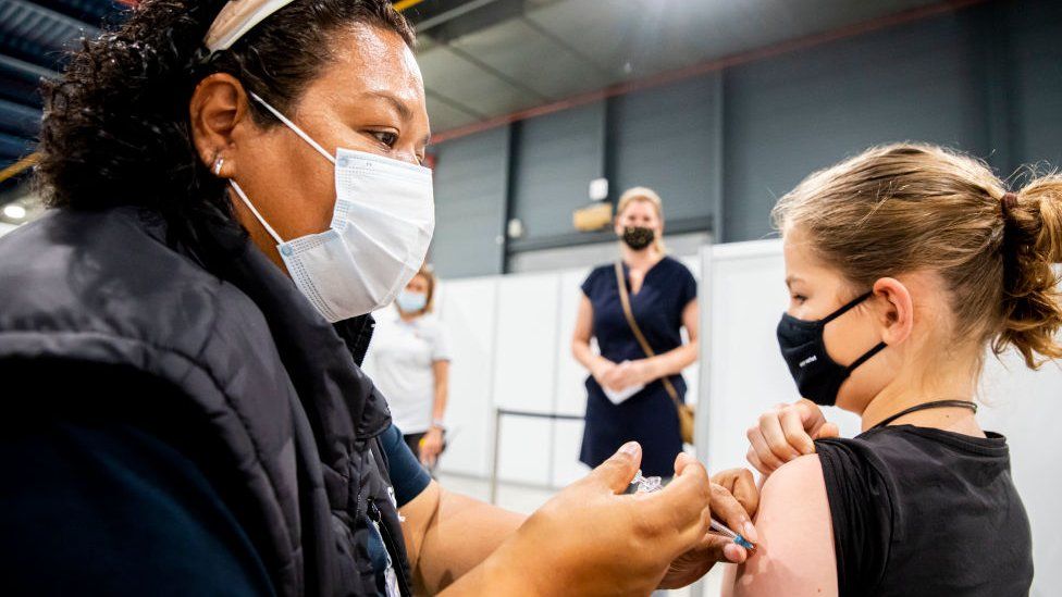 Child receiving Covid vaccine in the Netherlands in July