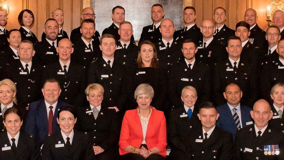 Theresa May with award winners