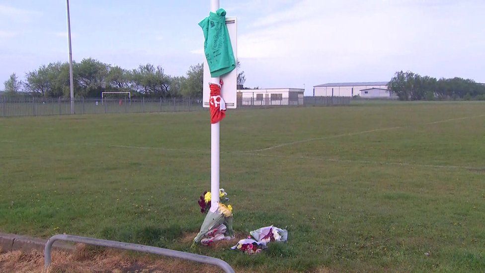 Tributes to boy at field