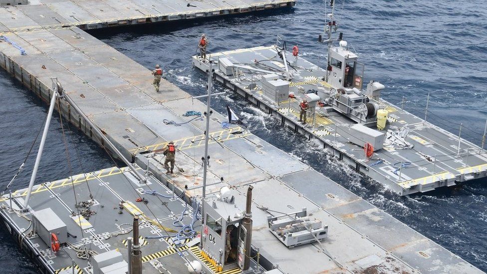 US military handout image showing the construction of the floating JLOTS pier in the Mediterranean Sea (29 April 2024)