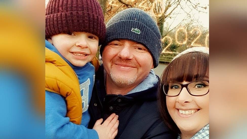 Aaron with dad and mum