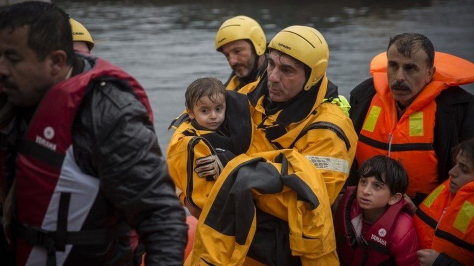 A Spanish volunteer helps migrants in Greece