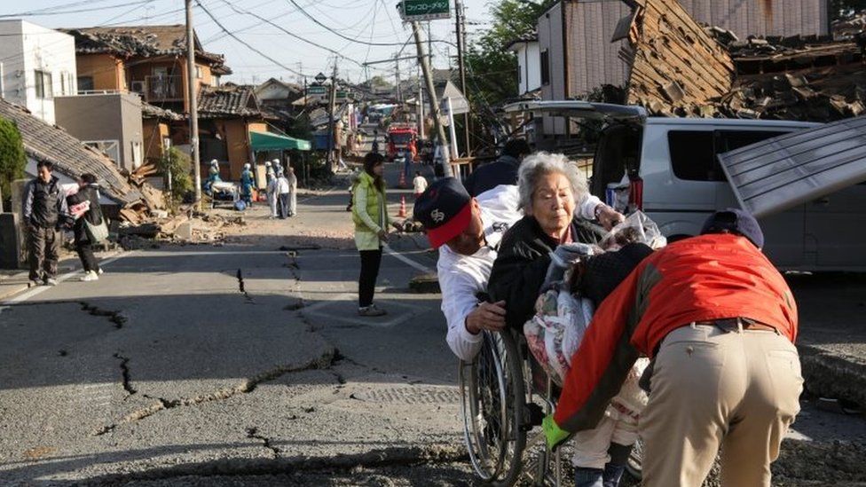 A Kumamoto resident is evacuated from the city. Photo: 16 April 2016
