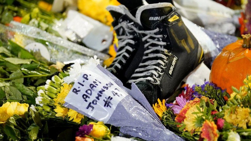 Floral tributes and ice skates