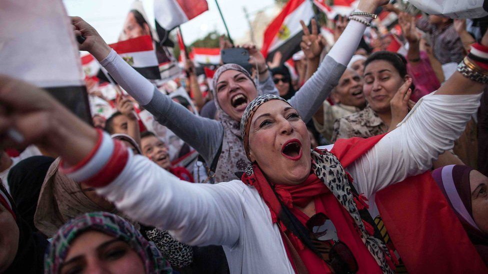 Egyptians celebrate in front of the presidential palace on June 3 2014 after ex-army chief Abdel Fattah al-Sisi won 96.9 percent of votes.