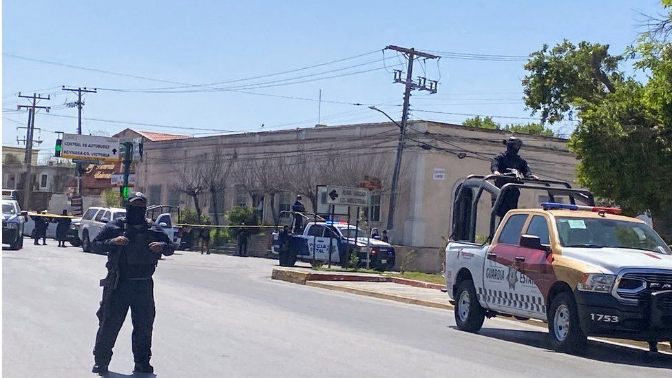 State police stand guard near the crime scene in Matamoros, Mexico