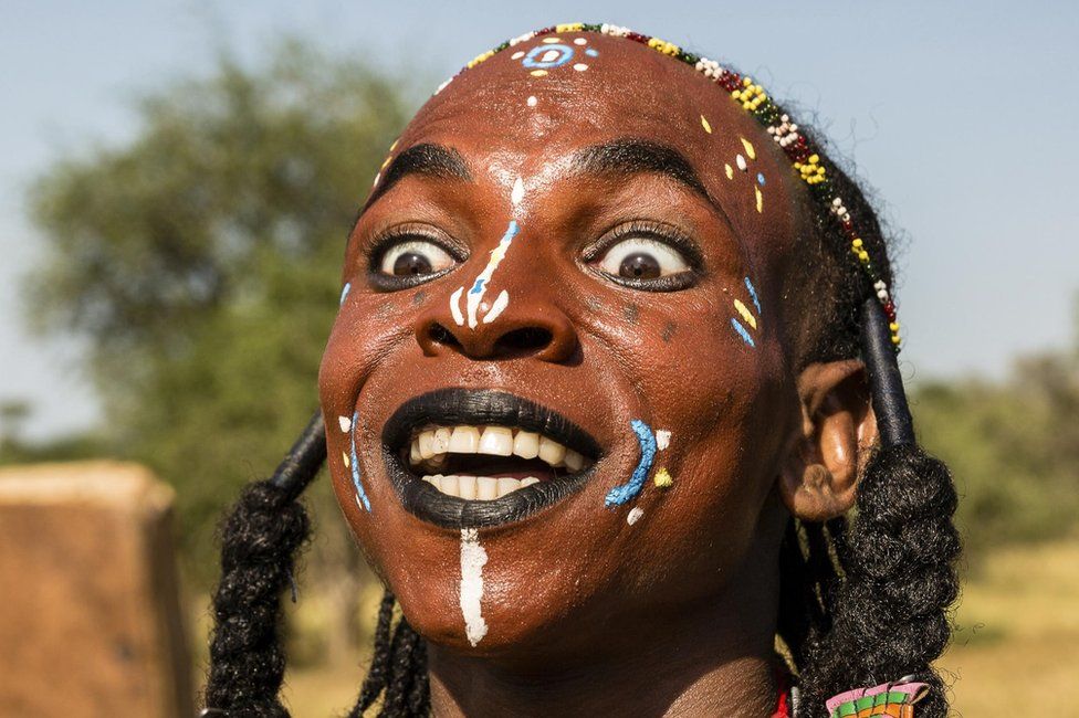 african tribal man painting