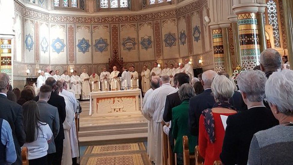 Nine men, including two prominent barristers, were ordained as Catholic deacons in Belfast on Sunday.