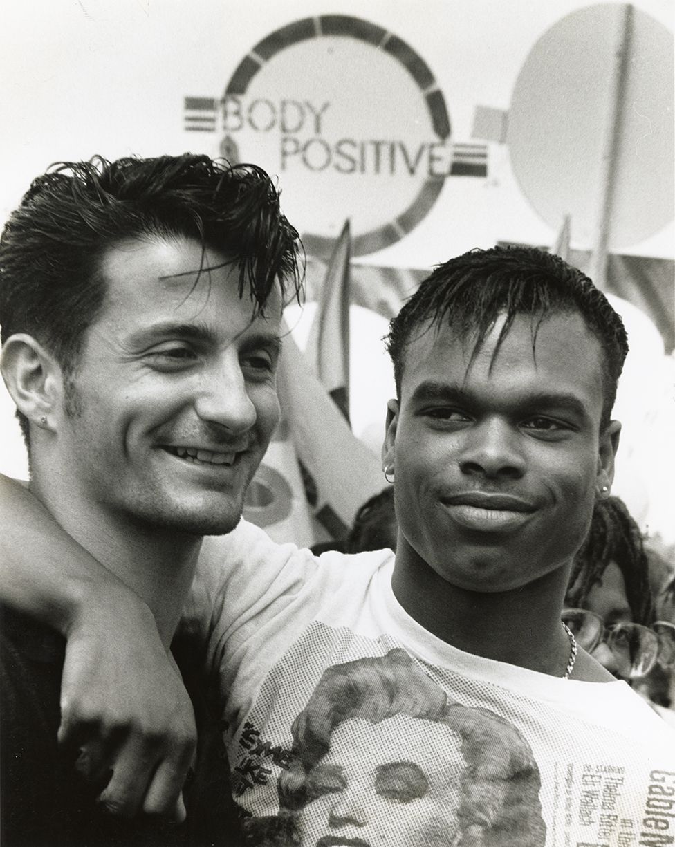 Two men attend a Pride march in 1988